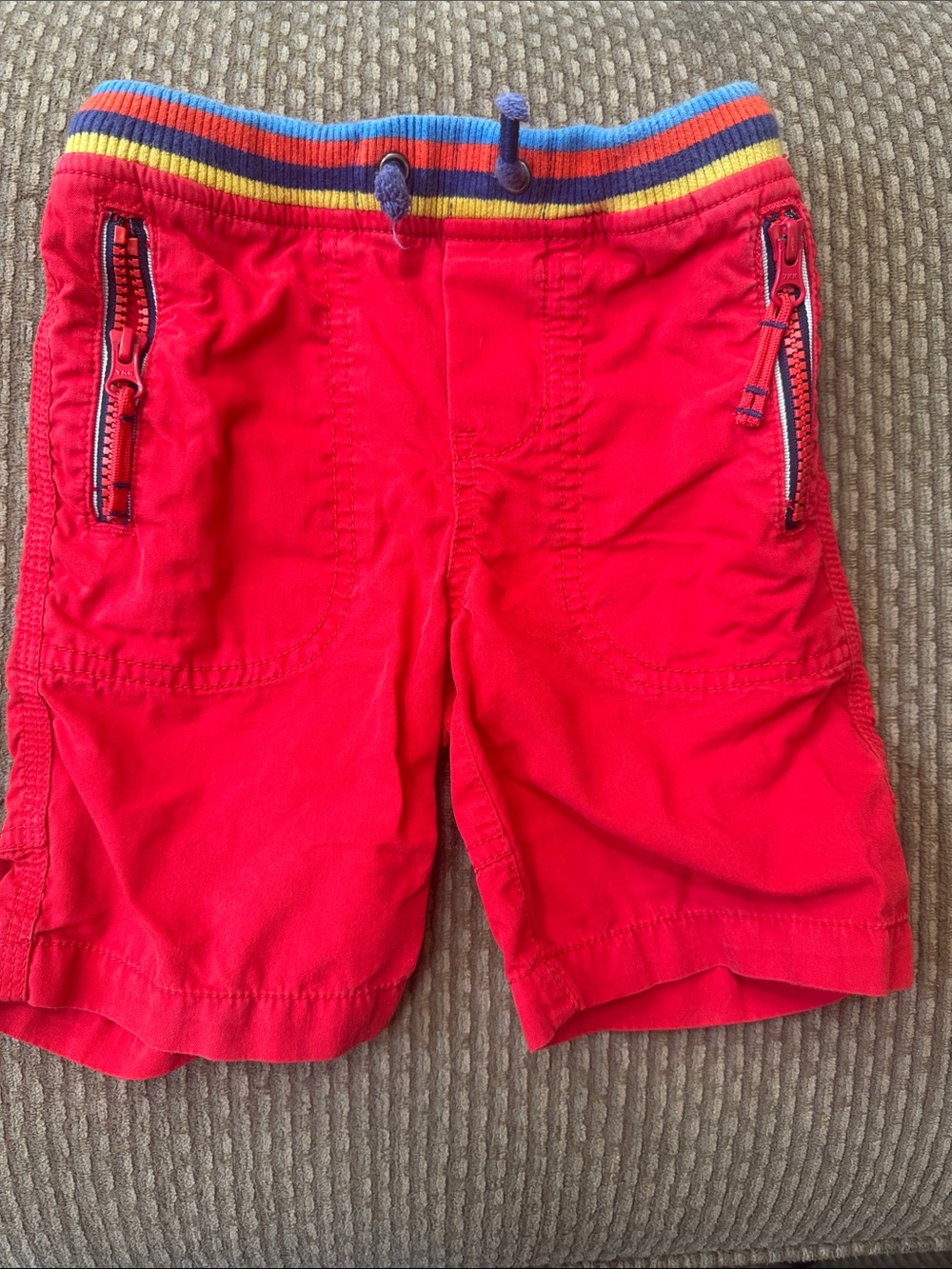 Mini Boden red kids' shorts with blue waistband trim